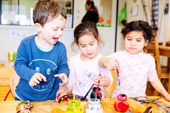 Children painting at kindergarten